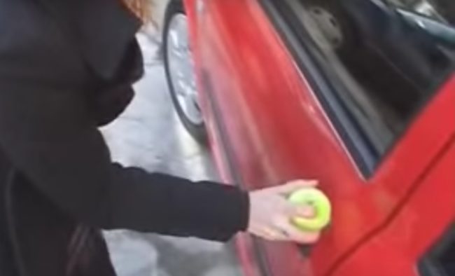 <strong>Life Hack: </strong>A tennis ball with a hole drilled through it can open up your car door without a key.