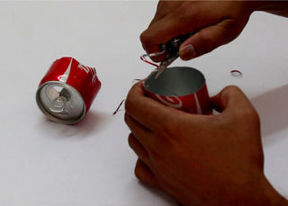 For the second can, he cut the top off with an army knife and smoothed the edges out with scissors.
