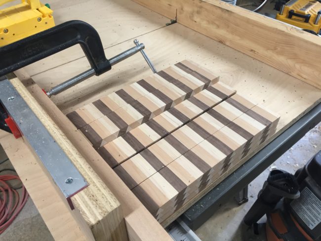 Next he crosscut tiles of wood to 1.75", the eventual thickness of the cutting board.