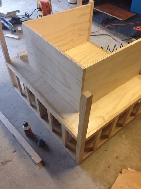 When the bottom was finished, he created the seat by gluing more plywood on top.