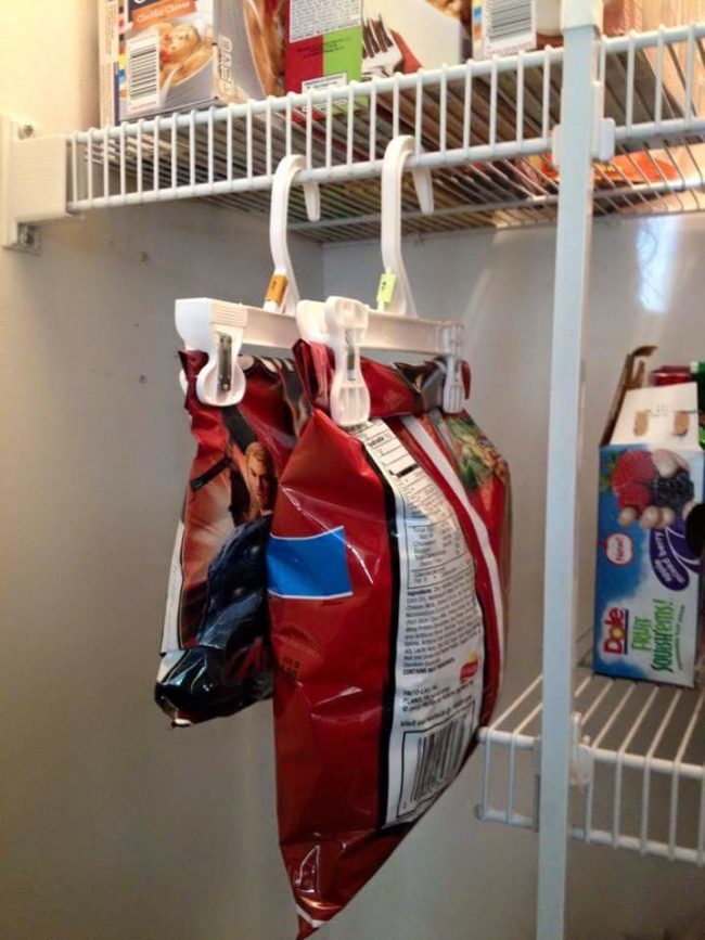 Use <a target="_blank" href="https://www.reddit.com/r/lifehacks/comments/37dggk/hang_your_chip_bags/">clothes hangers</a> with clasps to hang your chips in the pantry!
