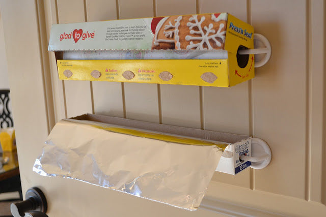 Hang your aluminum foil and saran wrap with <a target="_blank" href="http://www.areal-lifehousewife.com/2012/03/my-new-gig-over-at-ask-anna.html/">plastic hooks</a> for super easy access!