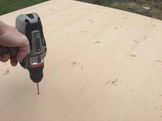 After cutting the boards to size, he started drilling small holes.