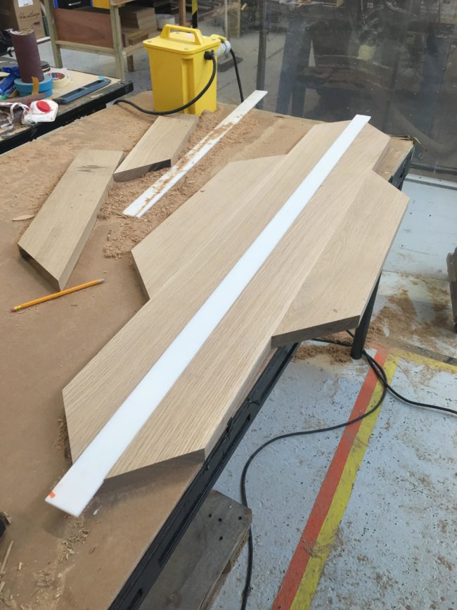 He cut a glacier-white piece of Corian to size and used it for the center of the table.