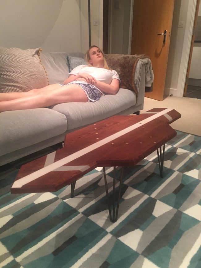 His girlfriend might not admire it, but this table is the perfect addition to their living room.