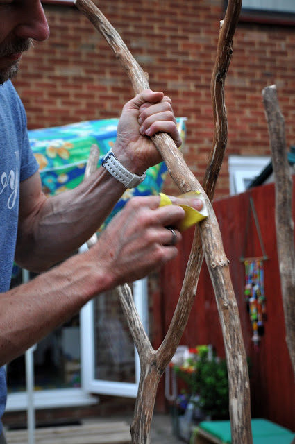 When the branch was bark-free, her husband sanded it down.