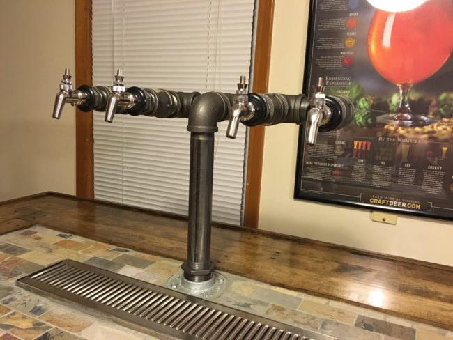 He assembled his tap after that, which was designed to dispense four different types of beer.