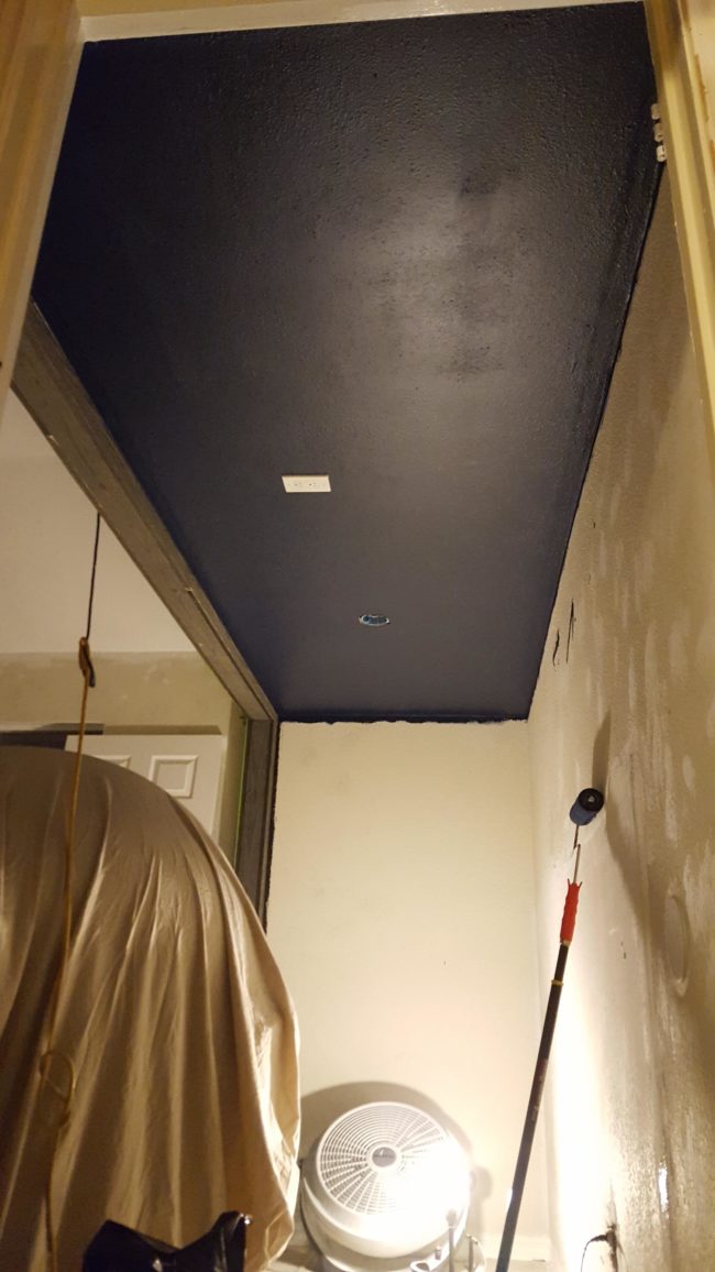 This area would be right above his son's bed, so he painted it a dark navy to look like the night sky.