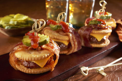 Cut down on the carbs with these <a href="http://www.snackworks.com/recipe/bacon-wrapped-cheeseburger-ritzwich-187016.aspx" target="_blank">mini cheeseburger sliders</a>.