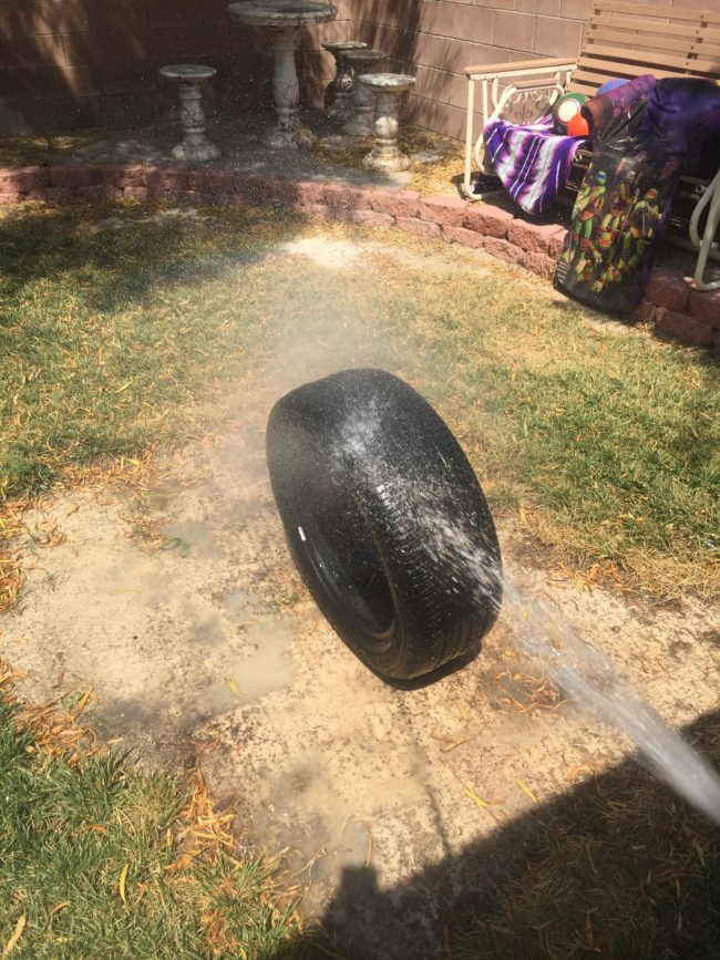 First things first -- nobody wants to ride a dirty tire, so he hosed it down.