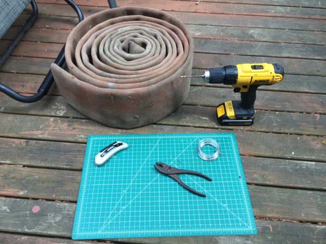 First, he found this old fire hose at a salvage shop, gathered  some bailing wire, and got  his tools ready.