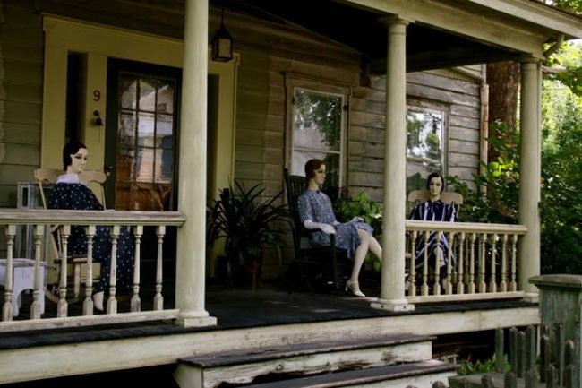 This is what the porch looks like on an ordinary day. Those people lounging in the rocking chairs? They're mannequins, fully dressed in early 20th-century clothing with freaky, painted-on faces.