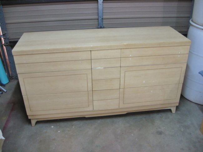 Next, he stripped the dresser of all its old finish.  Many of the pieces had to be sanded and glued back on.