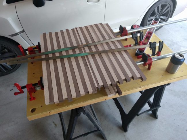 Using a miter saw, he cut each board into 12 strips.
