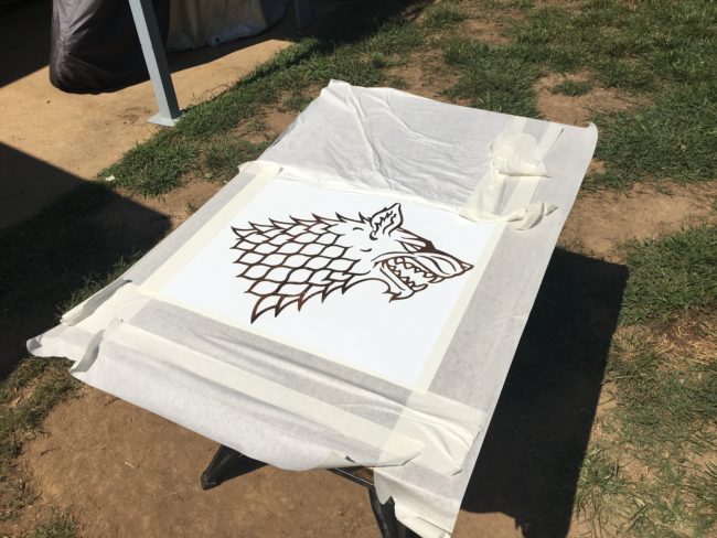 Next, he altered the Stark crest a bit to resemble his own pup, the gorgeous German shepherd in the photo above. He turned that design into a stencil.