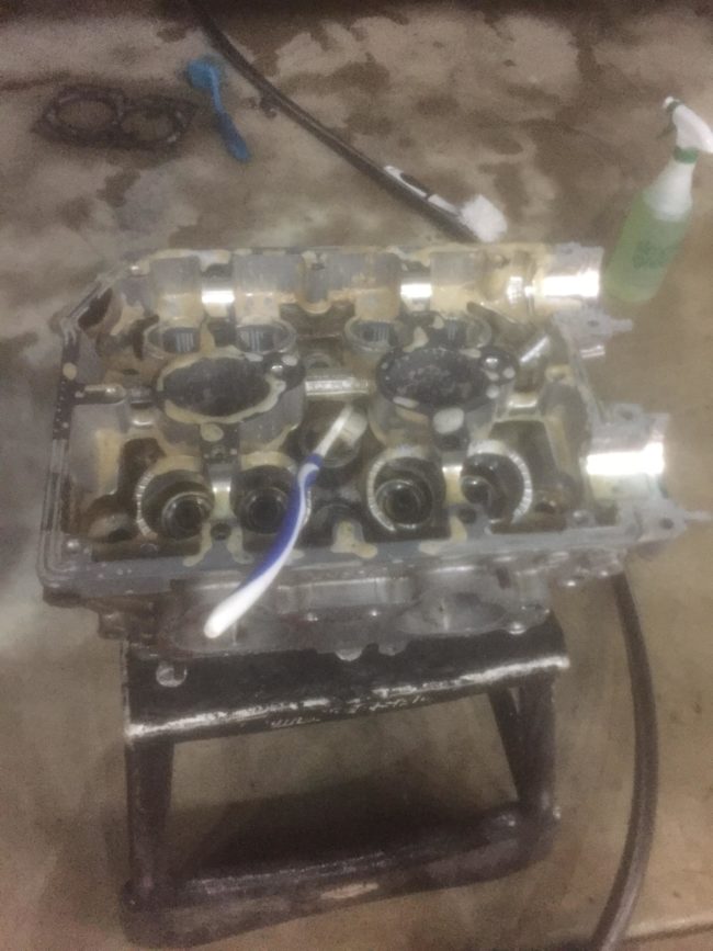 After realizing that it would take too much effort to rebuild the engine, they decided to turn it into a coffee table and began scrubbing it with dish soap.
