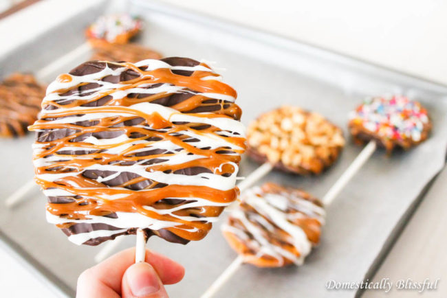 No tricks, just treats with these <a href="http://domesticallyblissful.com/caramel-apple-slices/" target="_blank">caramel apple pops</a>.