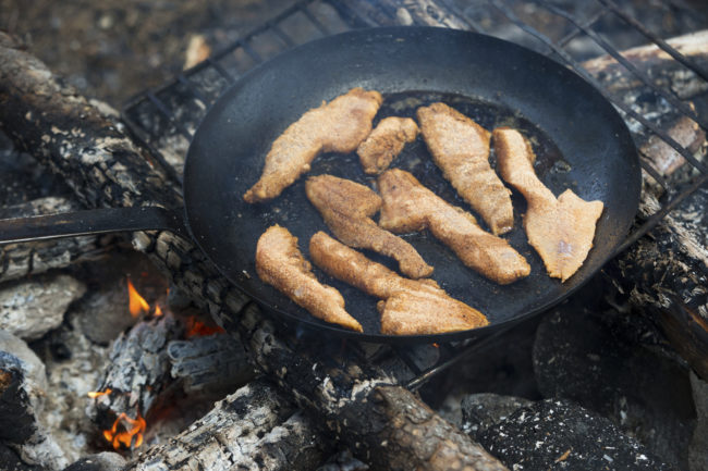 Rub a generous amount of dried soap onto the underside of your frying pan before placing it over a campfire to eliminate soot buildup.