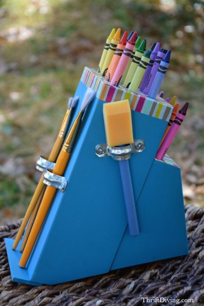 Turn a knife block into a <a href="http://thriftdiving.com/diy-crayon-holder-from-a-knife-block/" target="_blank">kid-friendly crayon holder</a>.