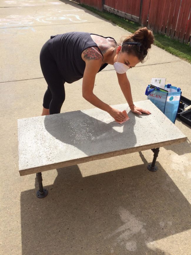 They then gave the tabletop a good sanding to smooth out any rough spots.