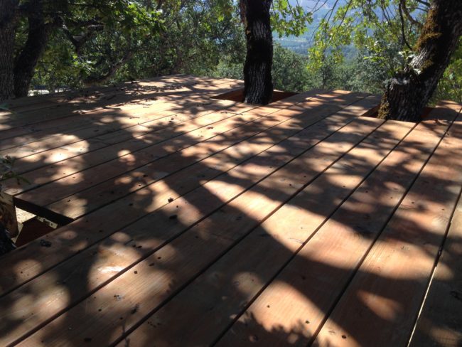 Next, he added deck pieces to the subflooring, making sure to give the tree trunks room to grow.