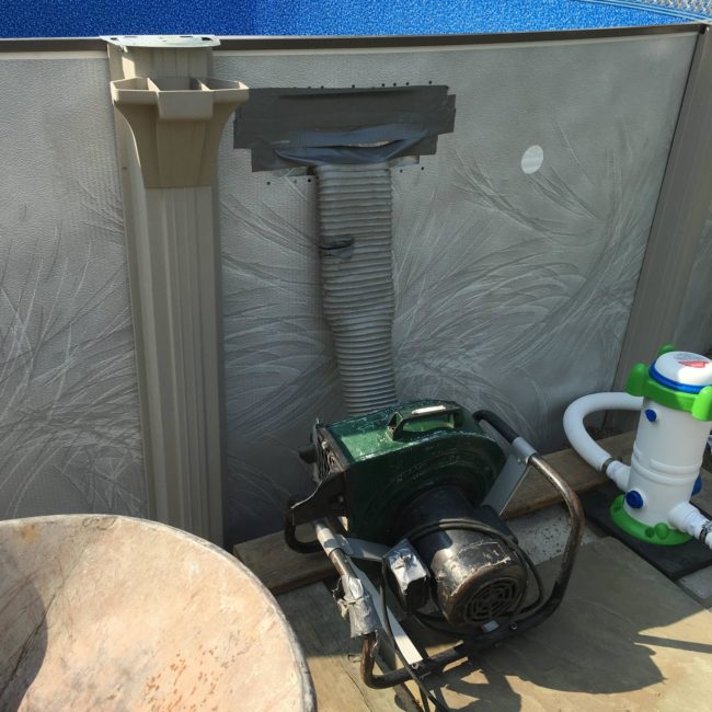 He used an industrial vacuum to ensure all air was removed from under the pool liner.