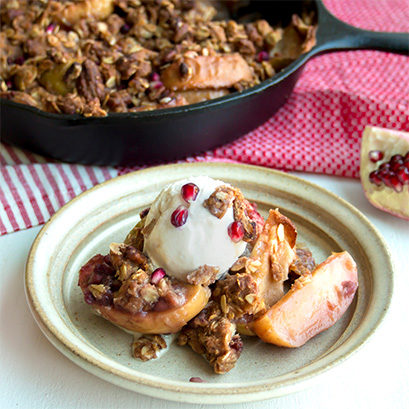 This <a target="_blank" href="https://glorybee.com/blog/cast-iron-apple-pomegranate-crisp/?pp=0">apple pomegranate crisp</a> with ice cream is completely to die for.