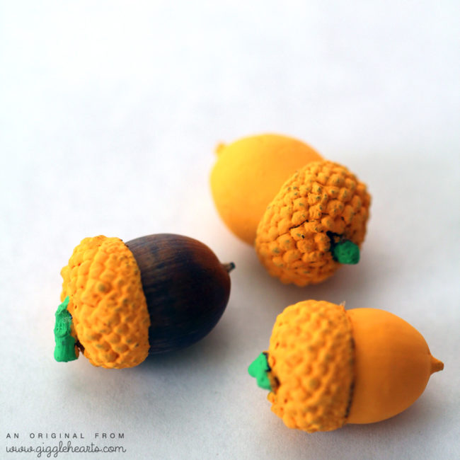 Give your acorns a festive look by painting them to look like pumpkins. 