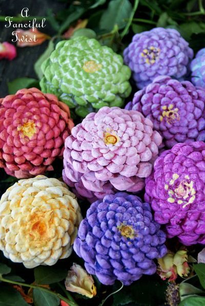 Who says everything has to be red and orange once fall rolls around? Some <a href="http://afancifultwist.typepad.com/a_fanciful_twist/2015/04/lets-make-zinnia-flowers-from-pine-cones.html" target="_blank">pinecones</a> and a little creative painting can help you pack a colorful punch.
