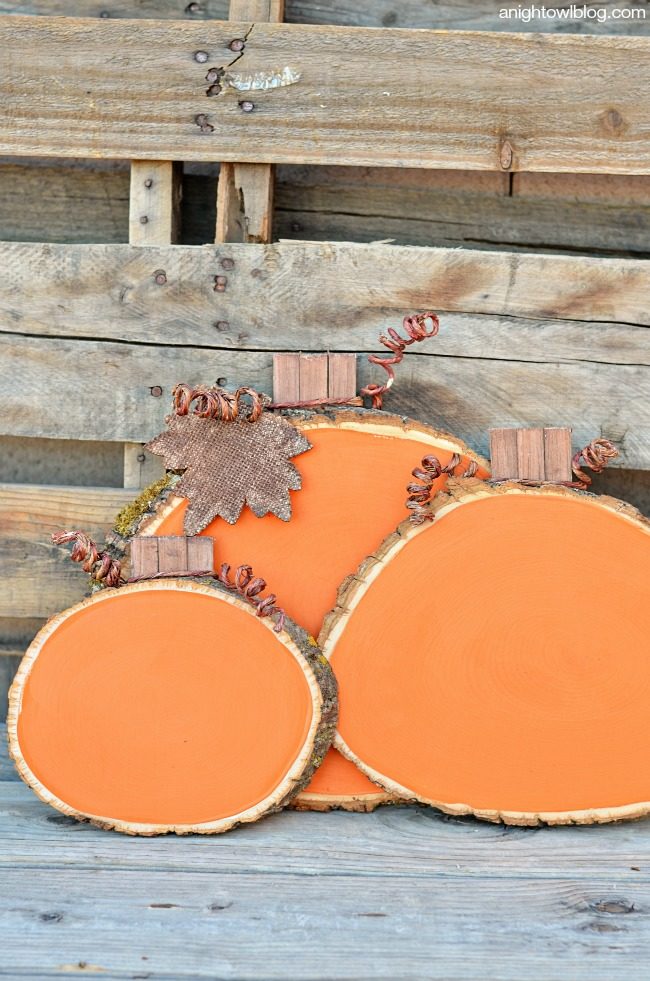 Grab some wood slices from the craft store (or cut a few yourself) and coat them with orange paint for perfect <a href="http://www.anightowlblog.com/2014/09/painted-wood-slice-pumpkins.html/" target="_blank">backyard accent pieces</a>.