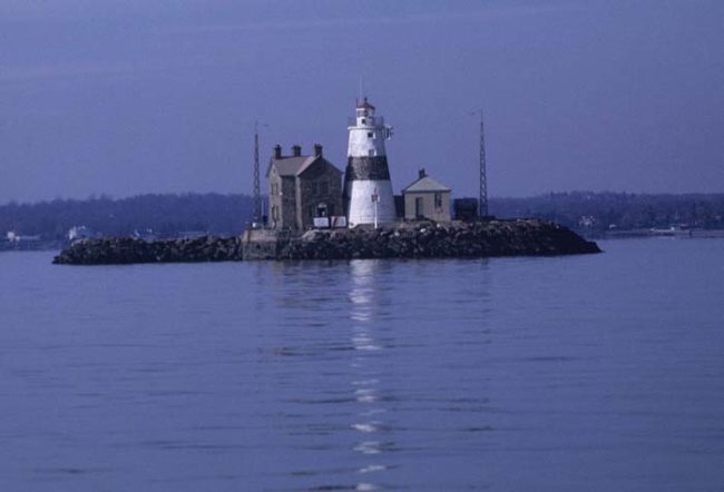 The lighthouse's name comes from the preferred method of the British in that area for executing criminals and traitors back in the day. They would chain them to the rocks upon which the lighthouse now stands at low tide. As the tide came in, they would drown.