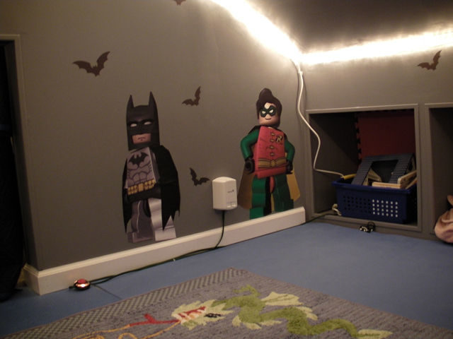 He gave the room a fresh coat of paint and added these awesome Batman wall decals.