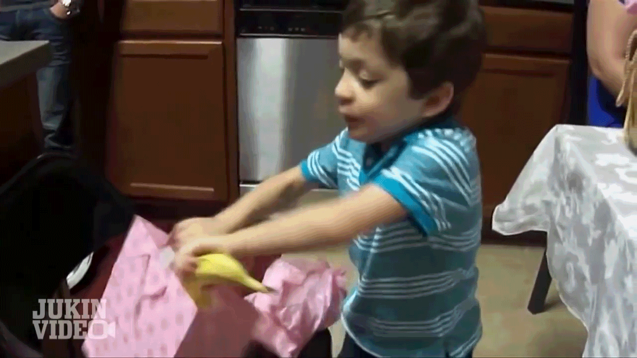 They say it's the thought that counts, but I think this kid was pretty excited about receiving a banana as a gift.