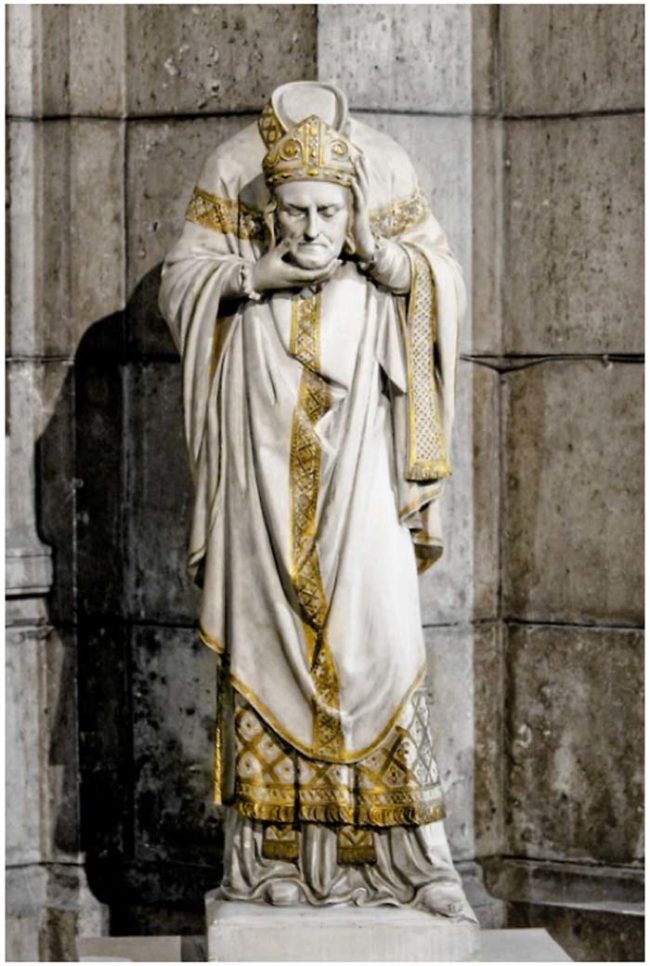 This is a statue of St. Denis. Can you guess how he died?