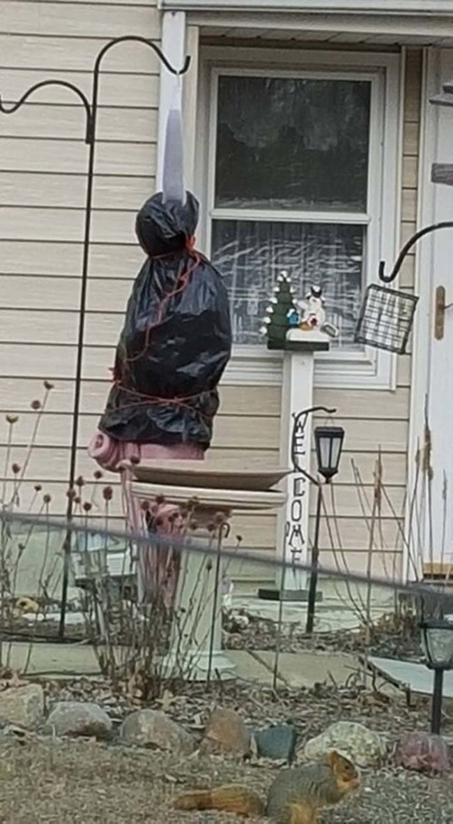 This person's attempt at keeping their religious statue from freezing is a bit frightening.