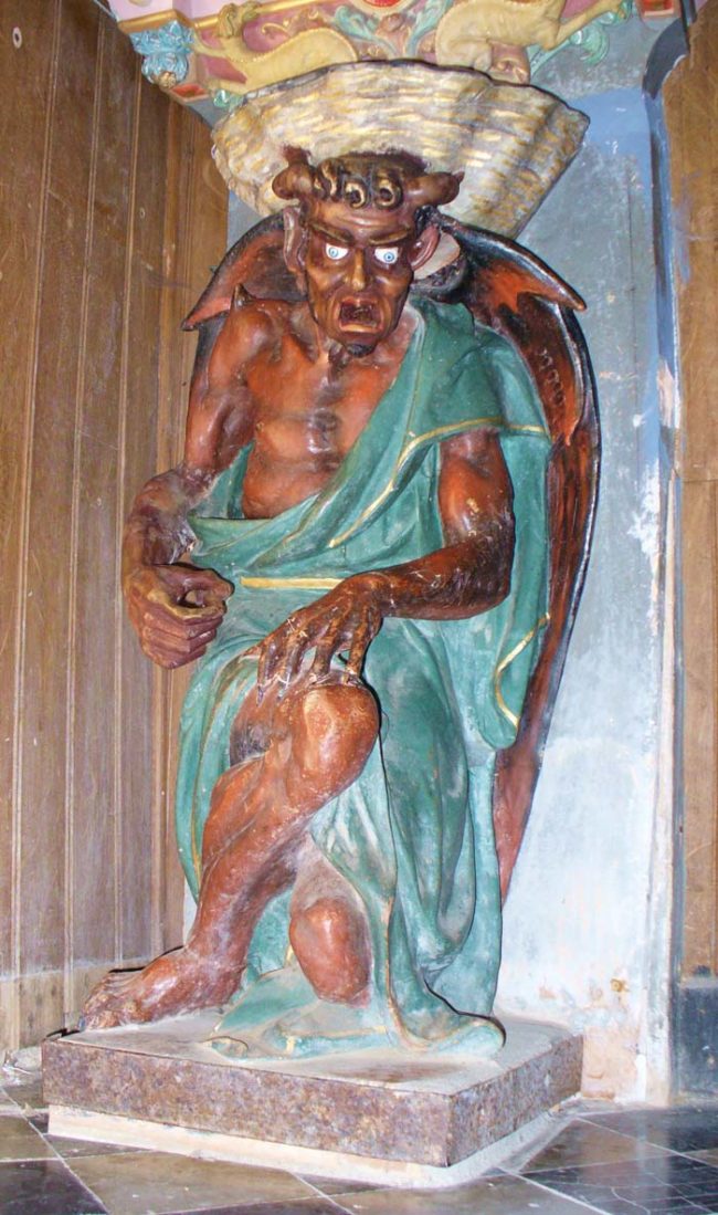 No, this isn't from a Satanic church. It's just a sculpture of the Devil hanging out in a Christian church.