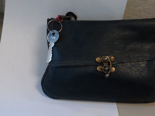 For easy access to your keys, thread a hair tie through a key ring and then do it again through your purse's handle.
