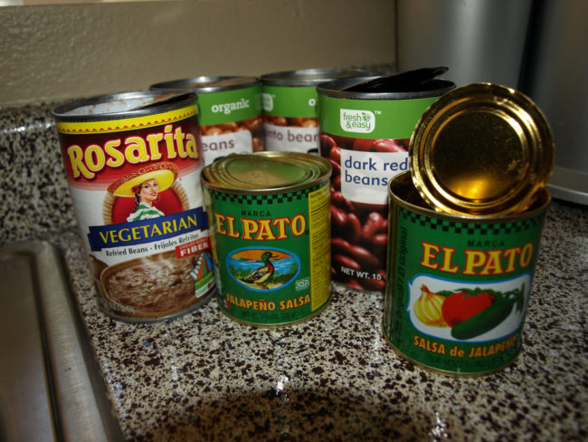 Use a tie to secure plastic wrap over opened canned foods to keep them fresh.