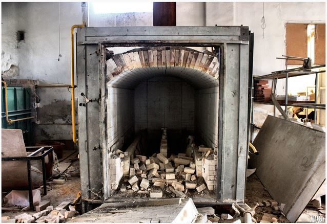 This furnace was used to bake the porcelain. It looks like a few doll parts never made it out.