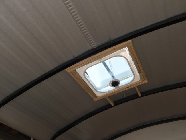 He cut out a hole for a ceiling vent and installed it using self-tapping screws.