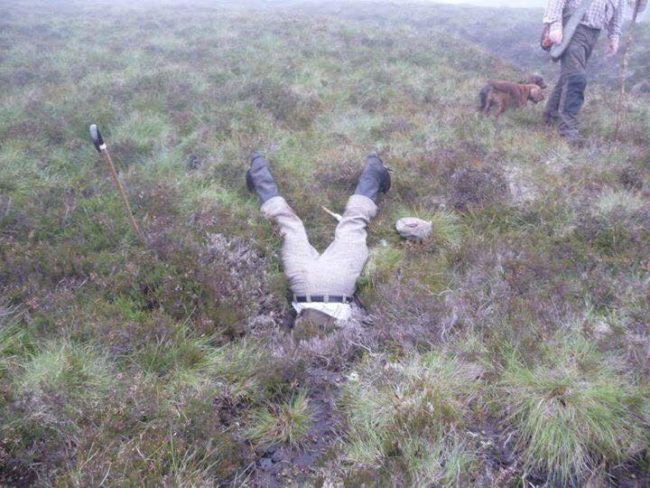 Talk about diving in head-first into the rescue efforts. The team of gamekeepers had finally found the missing dog, but getting her to safety was a whole other story.