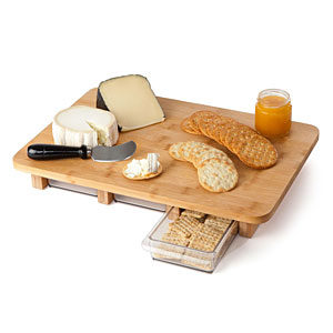 This <a href="http://www.thinkgeek.com/product/f433/?cpg=cj&amp;CJURL=&amp;CJID=1511450&amp;cpg=cj&amp;CJURL=&amp;cpg=cj&amp;ref=&amp;CJURL=" target="_blank">serving board</a> will allow you to store extra snacks underneath.