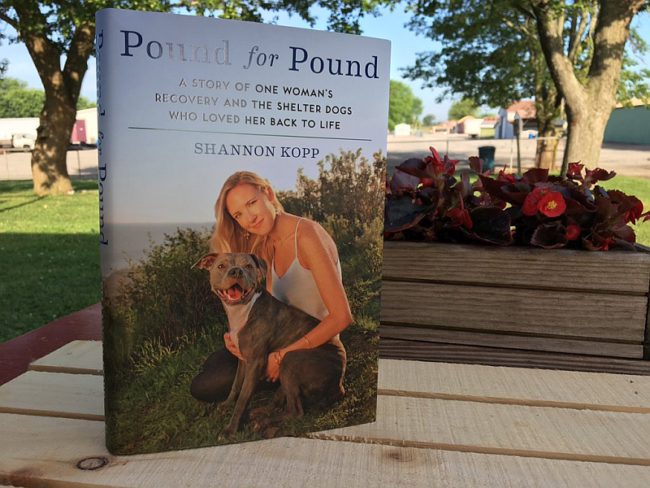 Kopp wrote a book that pays due reverence to her struggles and celebrates her triumphs that rode in on the backs of shelter dogs.