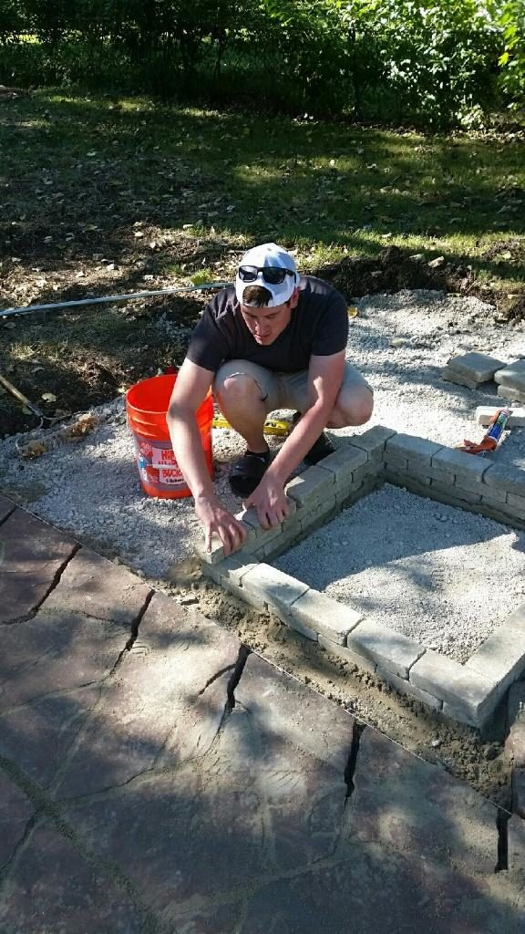 With the walkway finished, he began constructing the fire pit.