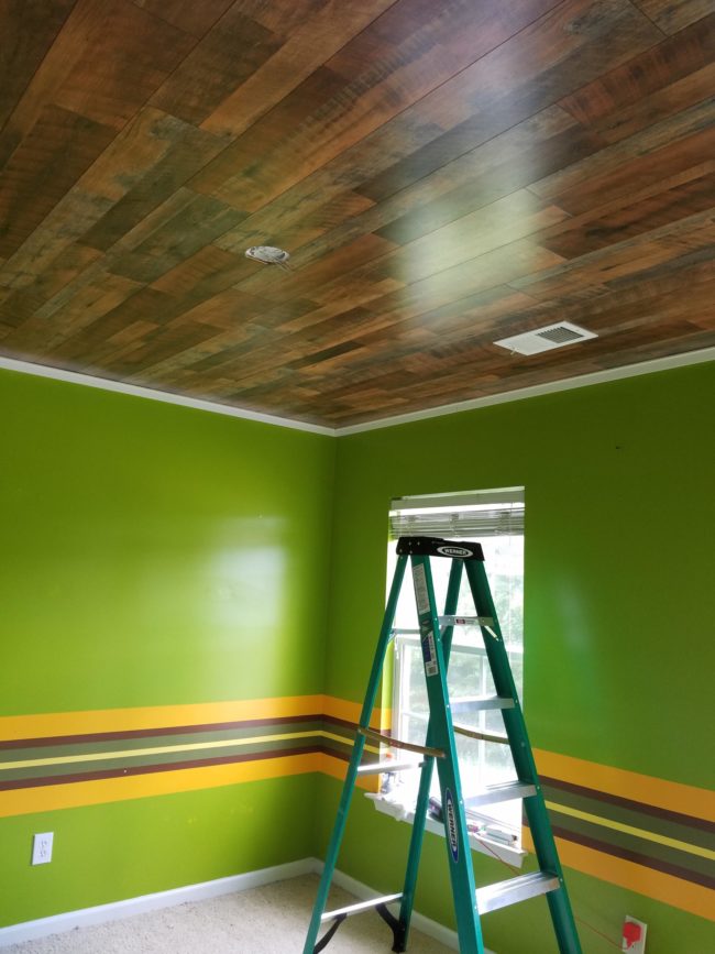 After they finished attaching everything, all they needed to do was cover the gaps at the edges with crown molding. Doesn't it look beautiful?