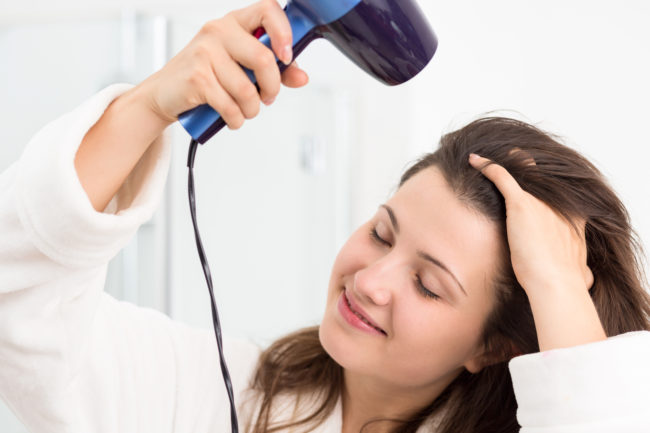 You aren't completely drying your hair or finishing with the cool setting.