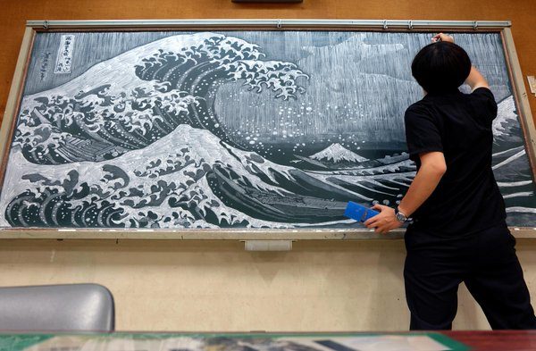 His chalkboard creations first caught the attention of the public after he depicted characters from Japanese anime series "Your Name."