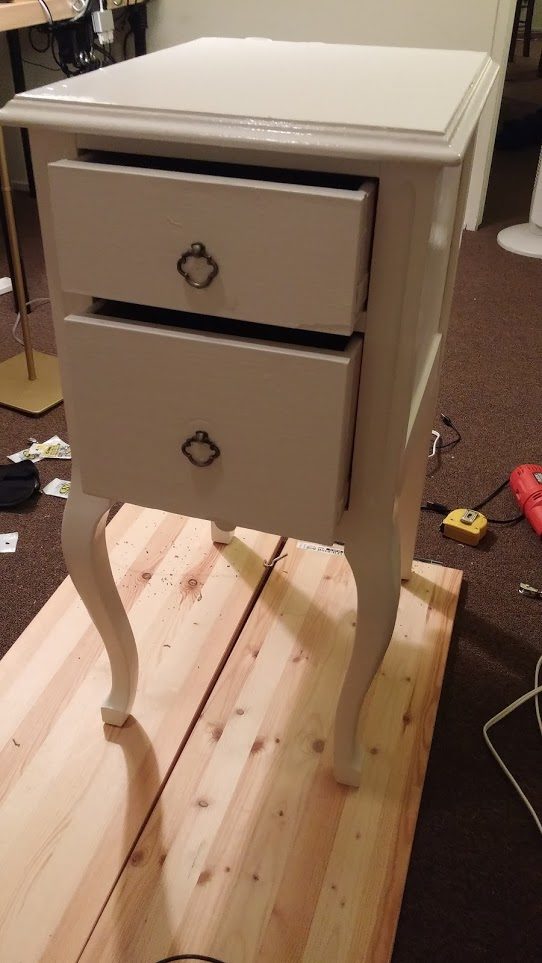 He purchased a nightstand on Craigslist to serve as the base for his charging table.