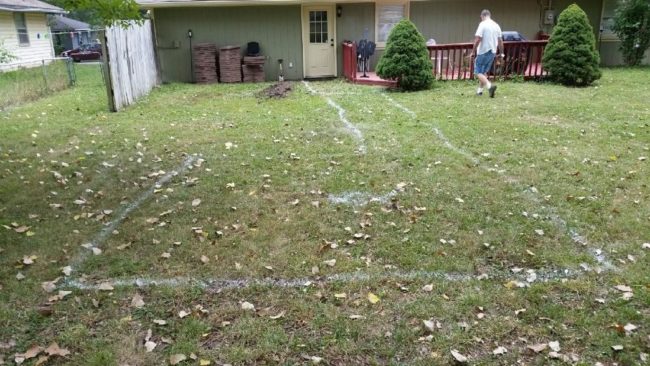 Our builder began by painting lines in the grass and marking off the dimensions of the patio.