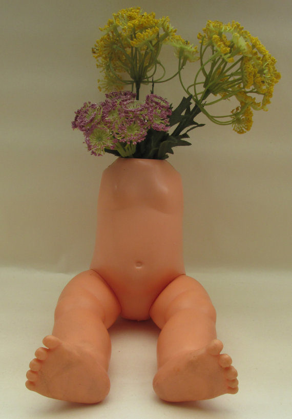 Flowers look so much prettier when they're placed inside <a target="_blank" href="https://www.etsy.com/listing/288278297/macabre-vintage-doll-torso-vase-vintage?ga_order=most_relevant&amp;ga_search_type=all&amp;ga_view_type=gallery&amp;ga_search_query=oddities&amp;ref=sr_gallery_28">doll torsos</a>.
